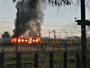 Passengers made a lucky escape after two train carriages caught alight at the Elandsfontein station in Germiston on Tuesday.