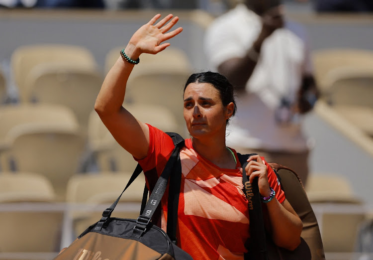 Tunisia's Ons Jabeur waves to the spectators and walks off the court after losing her quarter final match against Brazil's Beatriz Haddad Maia at the French Open at Roland Garros in Paris, France on June 7 2023 Picture: CLODAGH KILCOYNE/REUTERS