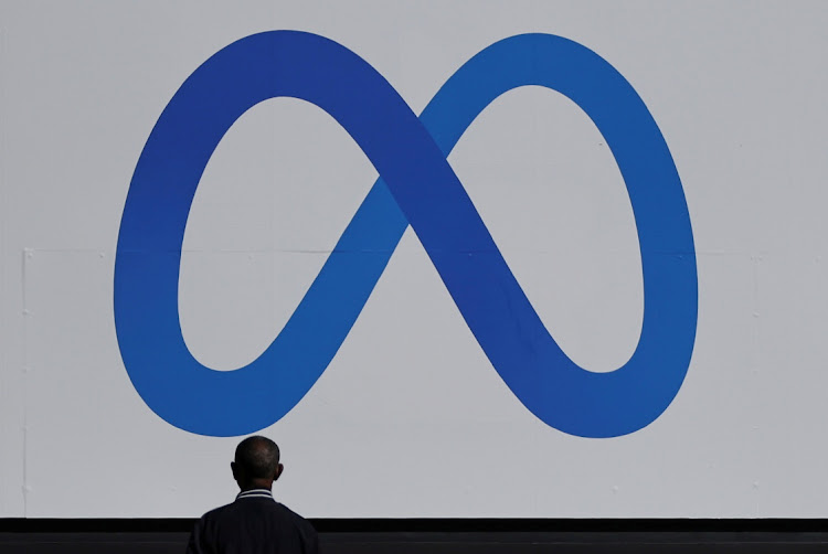 A man stands in front of a sign of Meta, the new name for the company formerly known as Facebook, at its headquarters in Menlo Park, California. Picture: REUTERS/CARLOS BARRIA