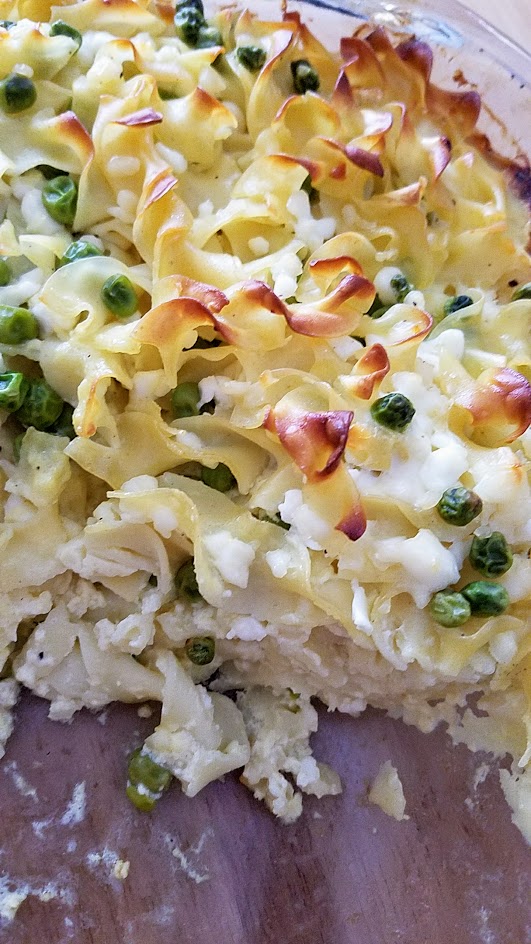 This Savory Cheese Kugel Recipe is my take on the Jewish casserole with egg noodles, butter, eggs, and cheese, with other optional add ins like here, peas and sauteed onions