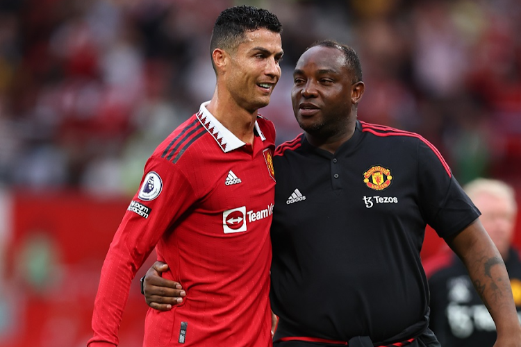 Cristiano Ronaldo celebrates Manchester United's 3-1 victory over Arsenal with SA coach Benni McCarthy.