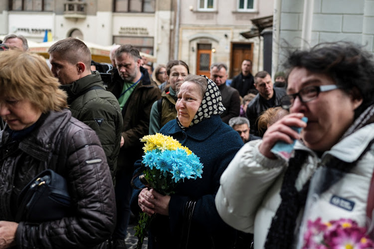 People attend the funeral ceremony of Yuriy Dadak-Ruf and Taras Kryt, killed due to artillery shelling in the Luhansk region, as Russia's invasion of Ukraine continues, in Lviv, Ukraine, April 9 2022. Picture: VIACHESLAV RATYNSKYI/REUTERS