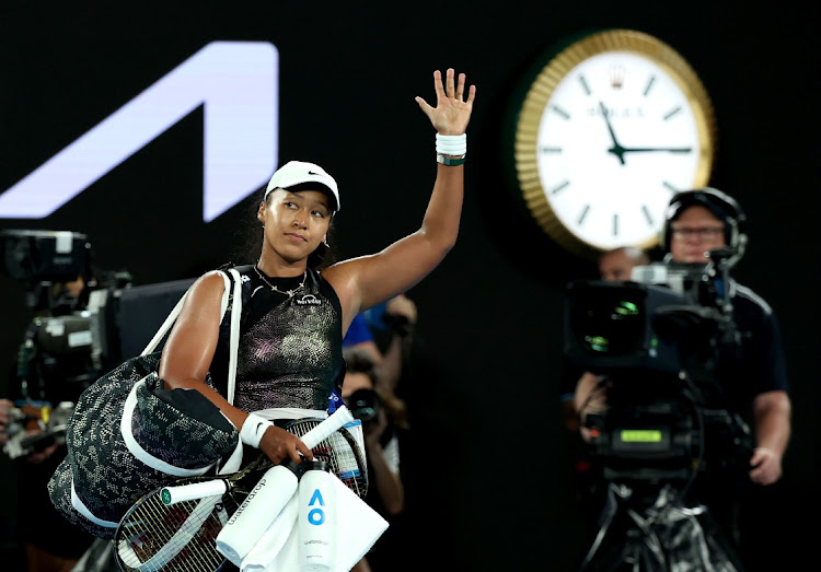 Japan's Naomi Osaka acknowledges the fans after her first round loss to France's Caroline Garcia at the 2024 Australian Open at Melbourne Park.