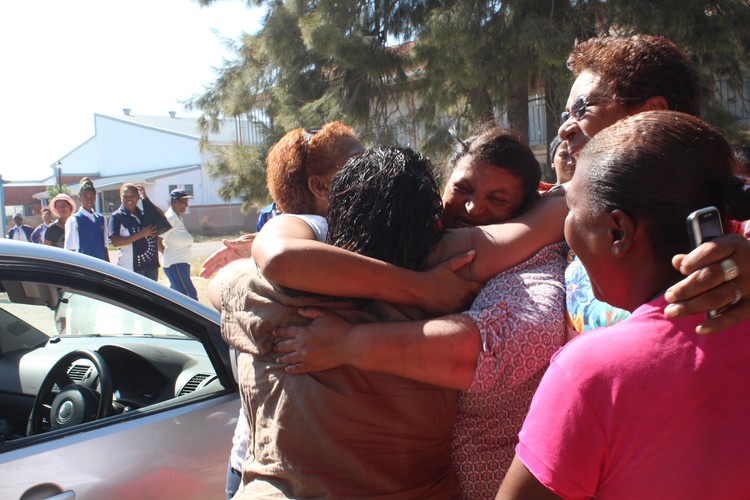 Parents at Uitsig Secondary School in Elsies River, Cape Town, celebrate on January 17 2019 after the school reopened following a court order.