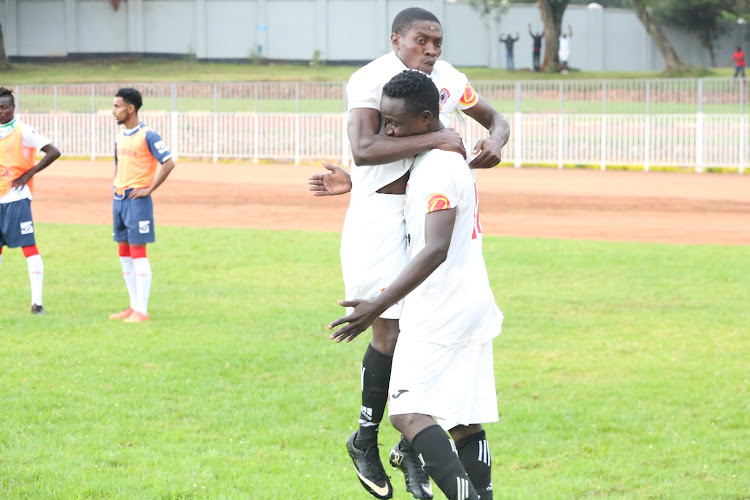 Dennis Onyancha (left) and John Musyoka celebrate after Musyoka scored for Shabana in their FKF NSL game at Gusii Stadium against Thika United.