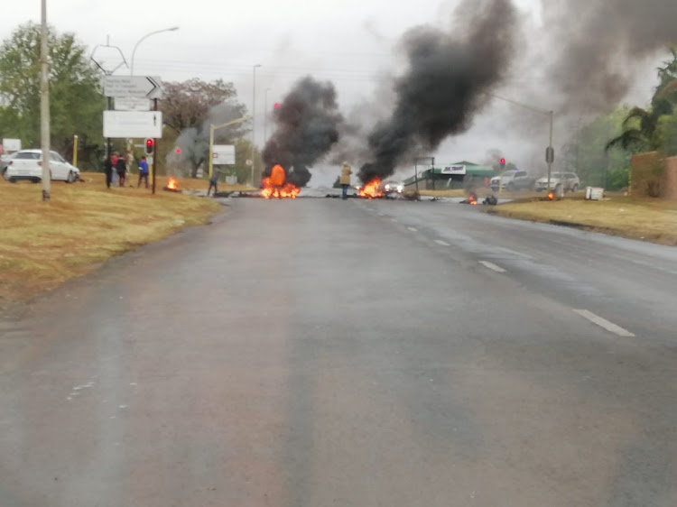 Newcastle residents blocked off the main entrances to the town with burning tyres and rocks on Friday.