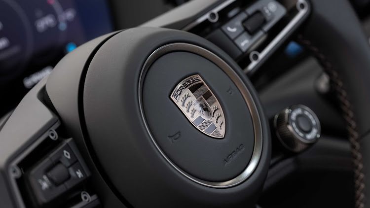 Multifunction steering wheel houses the rotary driving mode switch for selecting Normal, Sport and Sport Plus modes.