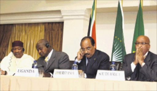 At the AU media briefing on developments in the Libyan conflict in Pretoria yesterday, President Amadou Toumanri Toure, of Mali, President Yoweri Museveni, of Uganda, President Mohamed Ould Abdel Aziz, of Mauritania, and President Jacob Zuma Picture: SYDNEY SESHIBEDI