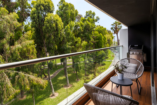 Prestige property for sale in San Isidro (Peru) - Balcony with furniture overlooking wooded park