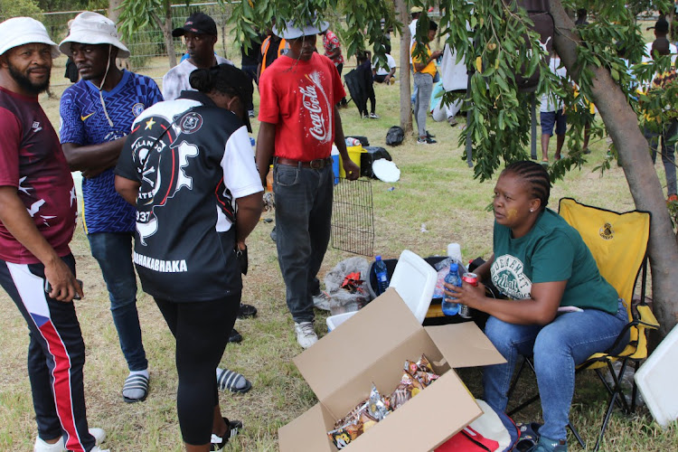 Vendor Zandile Khumalo sells drinks and snacks outside FNB Stadium before the Soweto derby between Orlando Pirates and Kaizer Chiefs on Saturday.