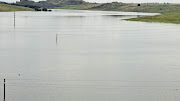 The four Eskom power lines which were submerged when a dam at the Optimum Mine overflowed on Saturday.