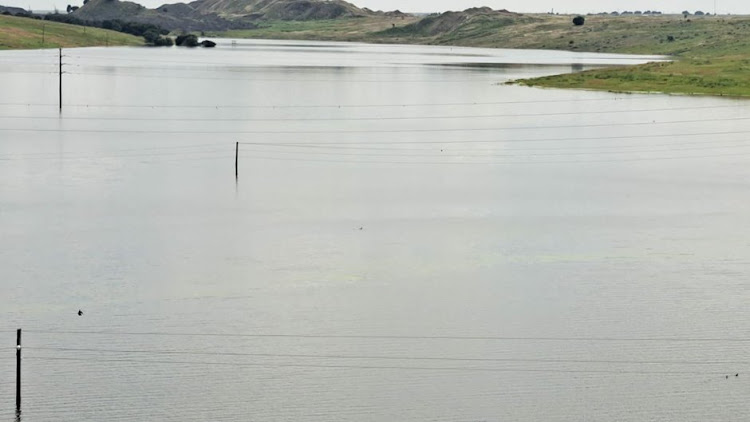 The four Eskom power lines which were submerged when a dam at the Optimum Mine overflowed on Saturday.