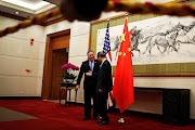 US secretary of state Mike Pompeo chats with China's state councillor Yang Jiechi as they proceed to their meeting at the Diaoyutai State Guesthouse in Beijing, China on Monday. 