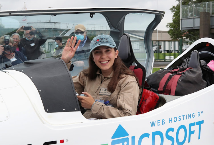 Belgian-British pilot Zara Rutherford, 19 poses for pictures before departing for a round-the-world trip in a light aircraft, aiming to become the youngest female pilot to circle the planet alone, in Wevelgem, Belgium, August 18, 2021.
