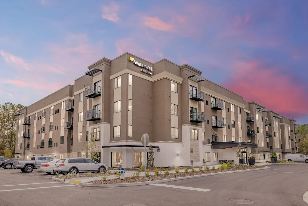 Exterior of four story building at dusk