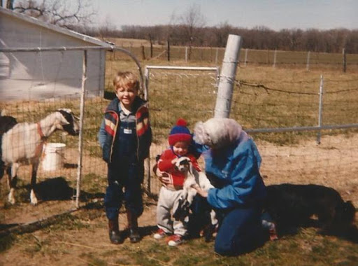 David, Brian and Granny at Chet and Lula Daharsh's feeding the goates.  David is 5 and Brian is 1.