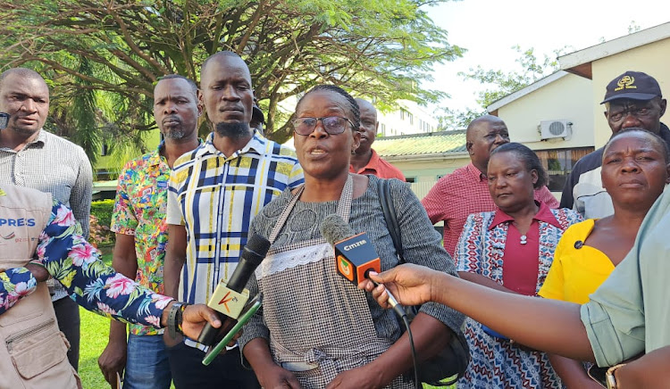 Kibuye Market chair Judith Matengo(Nyaramba) accompanied by other markets chairpersons addressing the media