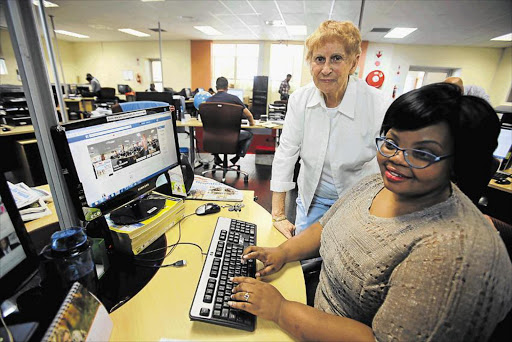 DOWN MEMORY LANE: Former Daily Dispatch employee Enid Lee, who worked as a copy typist in the ’40s, visited her former workplace this week as staff, including Phumza Sokana, were preparing to relocate to new premises in Beacon Bay Picture: SINO MAJANGAZA