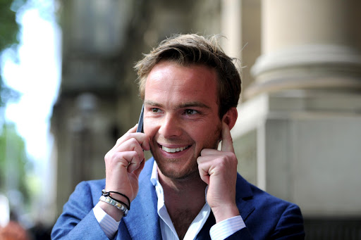 Dutch Formula One driver Giedo van der Garde reacts outside the Victorian Supreme Court in Melbourne on March 11, 2015, which ruled he can drive for Sauber at the season-opening Formula One Grand Prix in Melbourne this weekend. Van der Garde had claimed he was guaranteed a drive for the 2015 season but that the Swiss team reneged on the deal and instead handed births to Sweden's Marcus Ericsson and rookie Brazilian Felipe Nasr. AFP PHOTO / MAL FAIRCLOUGH -- IMAGE RESTRICTED TO EDITORIAL USE - STRICTLY NO COMMERCIAL USE