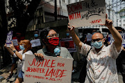 Members and supporters of a LGBTQ+ group protest the early release of US soldier Lance Cpl. Joseph Scott Pemberton, who was convicted of killing Filipino transgender woman Jennifer Laude, outside the Department of Justice in Manila, Philippines, September 3, 2020. 