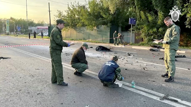 Investigators work at the site of a suspected car bomb attack that killed Darya Dugina, daughter of Russian ideologue Alexander Dugin, in the Moscow region, Russia, August 21 2022. Picture: INVESTIGATIVE COMMITTEE OF RUSSIA/REUTERS