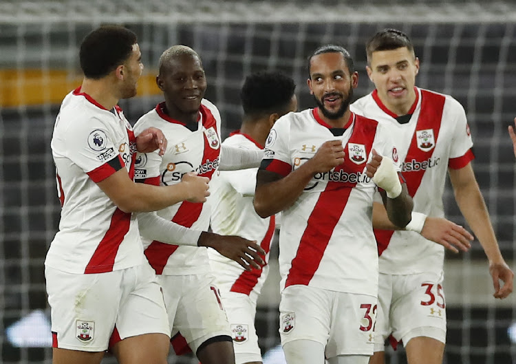 Theo Walcott celebrates scoring with teammates in the PRemier League match against Wolverhampton Wanderers at Molineux Stadium, Wolverhampton on November 23, 2020