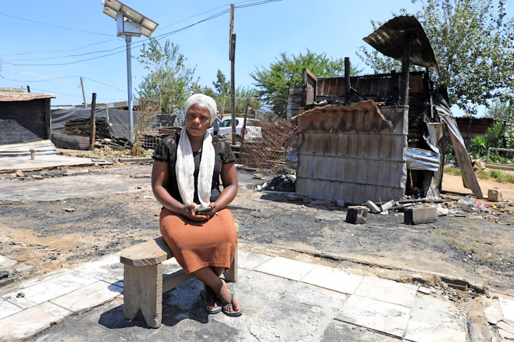 Naomi Kagwa is one of the residents who lost her belongings when 18 shacks burnt to the ground at Thabo Mbeki Village informal settlement near Lion Park, Johannesburg.