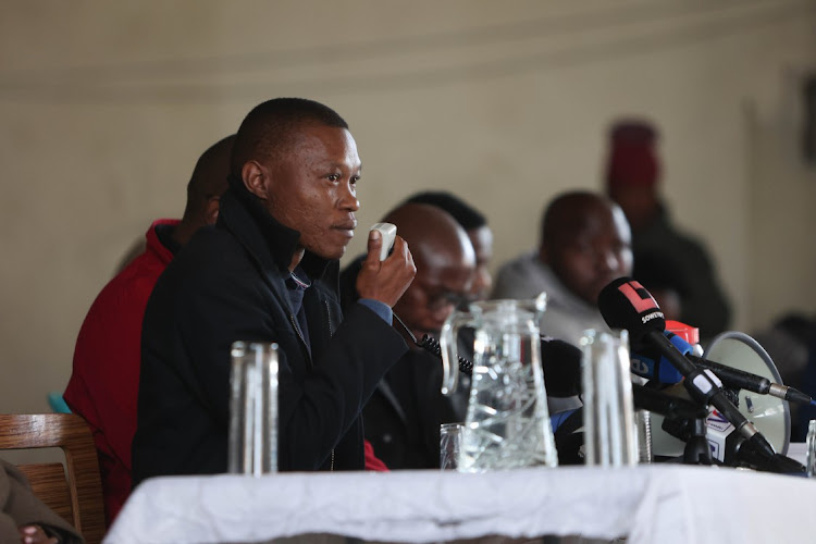 Johannesburg mayor Kabelo Gwamanda delivers an address to Diepkloof hostel residents at a hall in the hostel in Soweto on June 28, 2023, after days of service delivery protests in the area.