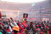 Members of the EFF gesture to stage as party president Julius Malema delivers the keynote address, 29 July 2023, at the political party’s tenth birthday celebration. 