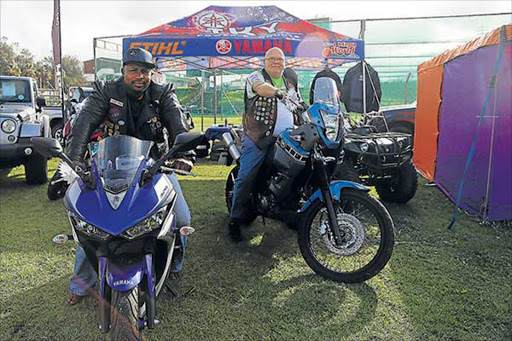 FULLY REVVED: Lonwabo Mguqulwa, left, of Alice United Riders and Rick Andrew, of the Christian Motorcylist Association, at the Golden Stallion Rally in East London Picture: SIBONGILE NGALWA