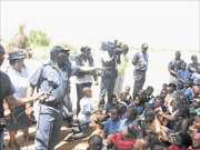 HELLO AND GOODBYE: Bheki Cele  addresses children at the Little Angel of Matsulu crèche about three hours before President Jacob Zuma announced his suspension.  PHOTO: RIOT HLATSHWAYO