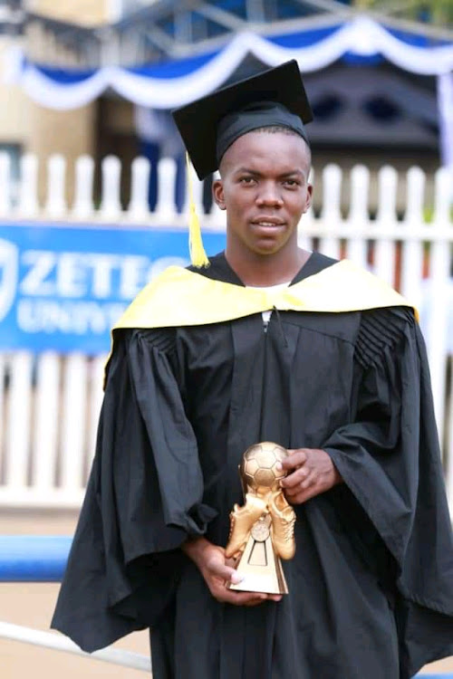 Ulinzi Stars' defender Quintine Indeche proudly displays a special gift he received from Zetech University in recognition of his efforts in sports. indeche was awarded a Bachelor's degree in Business and Information Technology. PICTURE: COURTESY