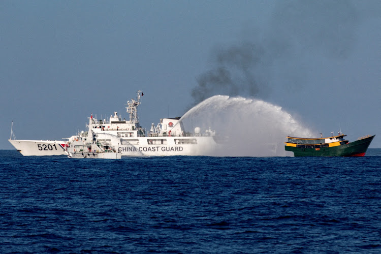 Chinese Coast Guard vessels fire water cannon towards Philippines resupply vessel 'Unaizah' en route to the Second Thomas Shoal in the South China Sea, March 5 2024. Picture: REUTERS/ADRIAN PORTUGAL