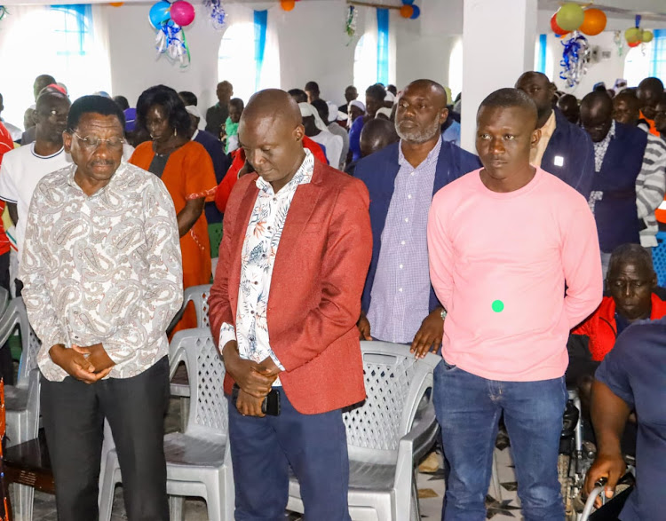 Siaya Governor James Orengo, township MCA James Otare and Gordon Onguru in Gem on Friday