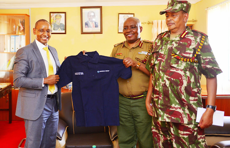 Madison Life Assurance managing director Githua Ngaruiya with Principal Deputy Administration Police Service Charles Karege and Border Police Unit commandant Addullahi Adan.