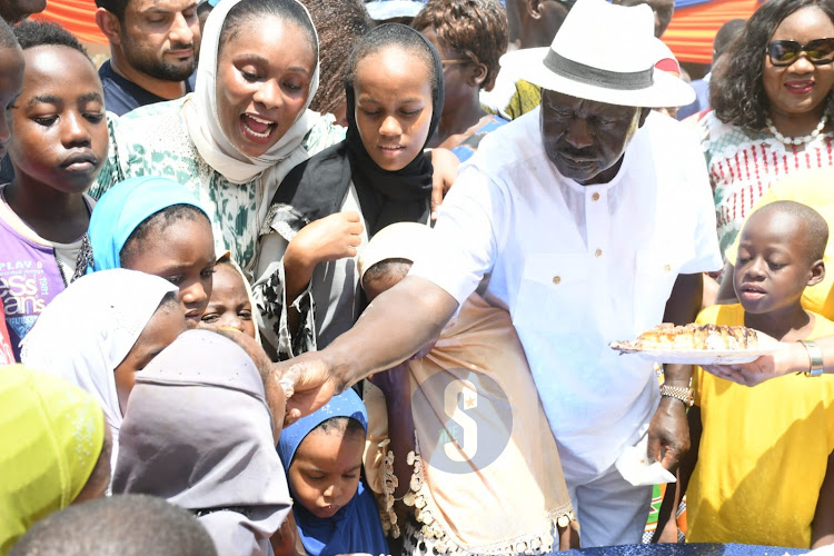 Azimio Leader Raila Odinga sharing cake with kids during celebrations of his 79th birthday in Malindi on Saturday, December 7, 2024.