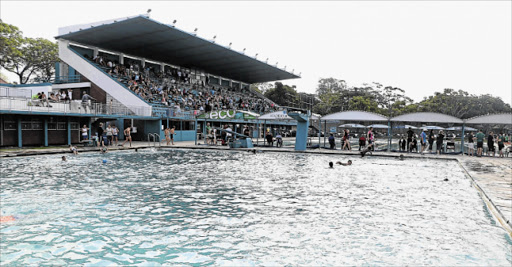 TAKING A SPLASH: Scores of East Londoners have fun in the water during a school gala after Joan Harrison pools reopened yesterday Picture: SISIPHO ZAMXAKA