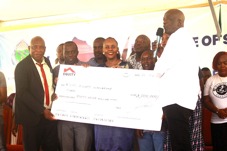 Kilifi governor Gideon Mung'aro (Right) during the launch of the National schools scholarship fund at Karisa Maitha grounds