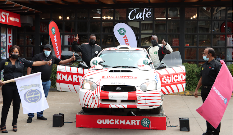 Driver Evans Kavisi and his navigator Absalom Aswani during the sponsorship presentation by Quickmart Operations Director Laurent Gouault (R), Jacques Dome (2nd L) and Betty Wamaitha (L).