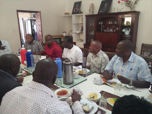 Unaitas Sacco board members with ODM leader Raila Odinga during a breakfast at the latter's home in Opoda, Bondo, Siaya county on Sunday, September 23, 2018. /COURTESY