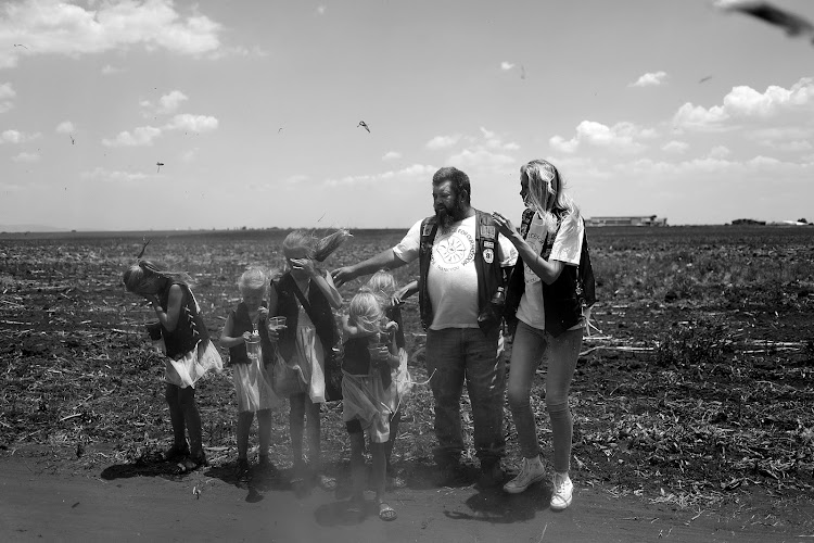 A family are photographed leaving a Poppy Day event in Brakpan, Johannesburg. The Regiment Chapter went to great effort to honour fallen soldiers.