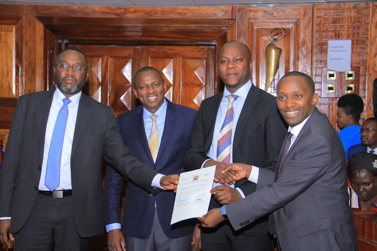 Senate Clerk Jeremiah Nyegenye, National Assembly majority leader Kimani Ichung'wa, EALA nominee Okeng'o Nyambane and National Assembly clerk Samuel Njoroge in Parliament.