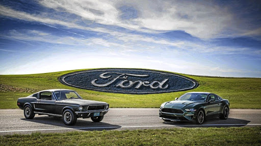 The new 2019 Bullitt (right) pays homage to the 1968 Mustang (left), with the same Dark Highland Green colour. Picture SUPPLIED