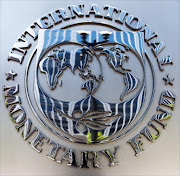The logo of the International Monetary Fund (IMF) is seen shortly after Christine Lagarde, Managing Director, spoke on the US economy during a press conference June 14, 2013 at IFM headquaraters in Washington, DC.