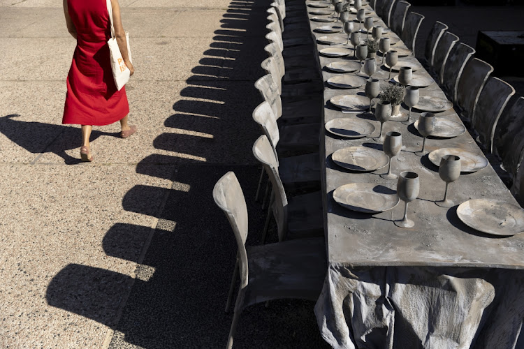 A woman passes by an installation remembering the hostages held in the Gaza Strip by Hamas, in Tel Aviv, Israel, May 15 2024. Picture: AMIR LEVY/GETTY IMAGES