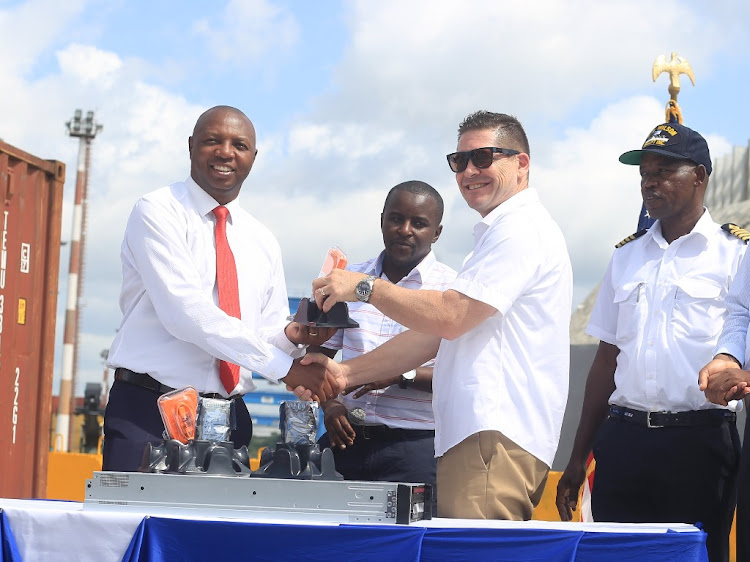 KPA managing director rch.Daniel Manduku receiving some of the container scanning gadgets from US ambassador to Kenya Kyle Mccarter at the Mombasa port on June 19, 2019.