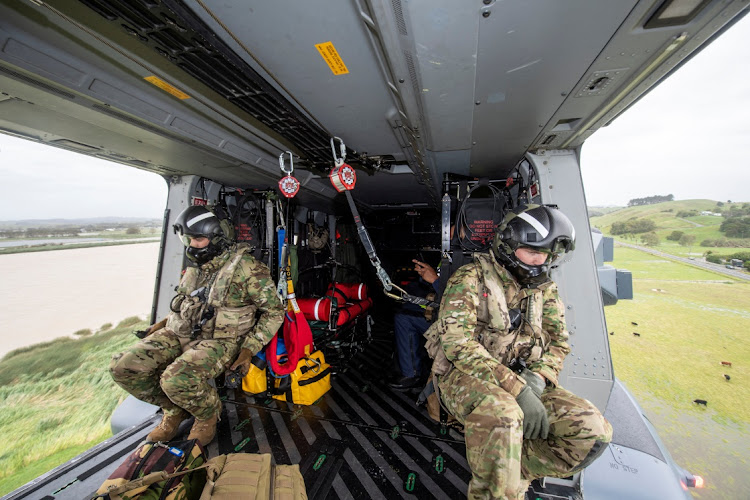 An NH90 helicopter travels from Base Auckland to Northland in response to the aftermath of Cyclone Gabrielle in this handout photo released on February 15, 2023. Picture: New Zealand Defence Force via REUTERS