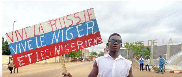 A Nigerien man holds a placard reading "Long Live Russia, Long Live Niger and Nigeriens" in the capital Niamey