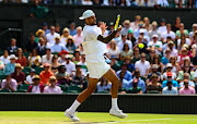 Nick Kyrgios of Australia hits a forehand against Brandon Nakashama of the US at The Championships Wimbledon 2022 on July 4 2022.