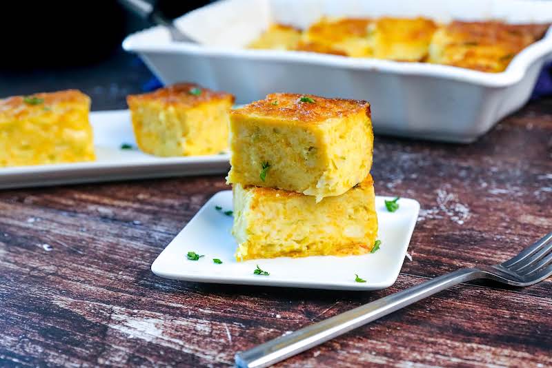 A Plate Of Green Chile Cheese Squares.